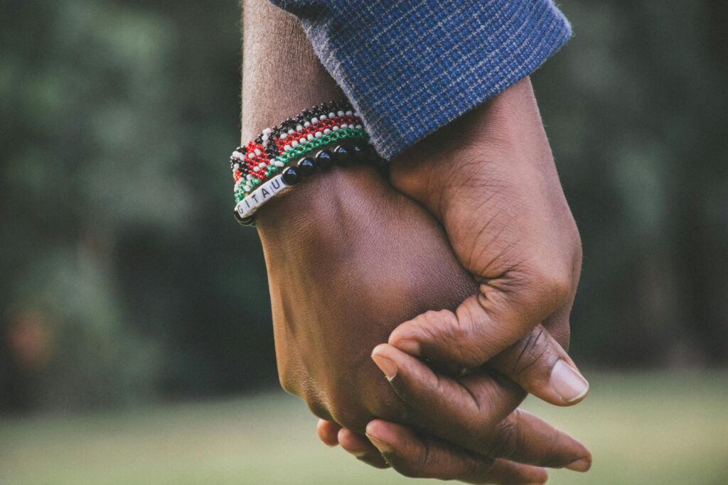 pexels-photo-1667849-1667849 A close-up view of a couple holding hands, symbolizing love and togetherness.